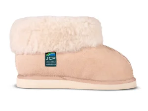 Side view of the Karoo Premium sheepskin slipper, featuring a plush wool collar, soft suede finish, and a sturdy light sole.