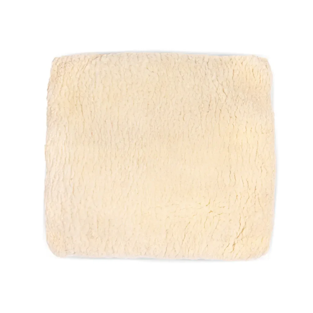 Square-shaped natural sheepskin wheelchair cushion, shown on a white background.