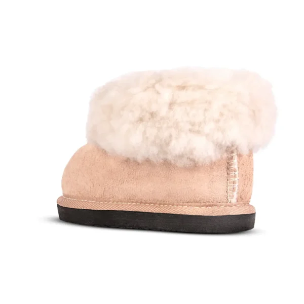 Side profile view of the Karoo Junior sheepskin slipper by JCP Leathers, featuring a plush wool collar and suede exterior.
