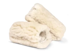 Pair of natural medical sheepskin grips designed for wheelchair or mobility support.