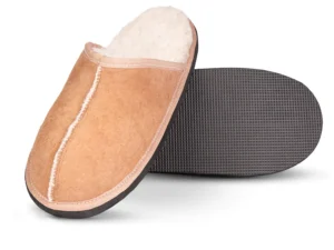 Top and sole view of Kalahari Classic sheepskin slipper, showcasing the stitched suede exterior, plush fleece lining, and durable black textured outsole.