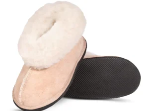 Karoo Classic sheepskin slipper shown at an angle, highlighting the soft suede upper, plush fleece collar, and textured black sole.