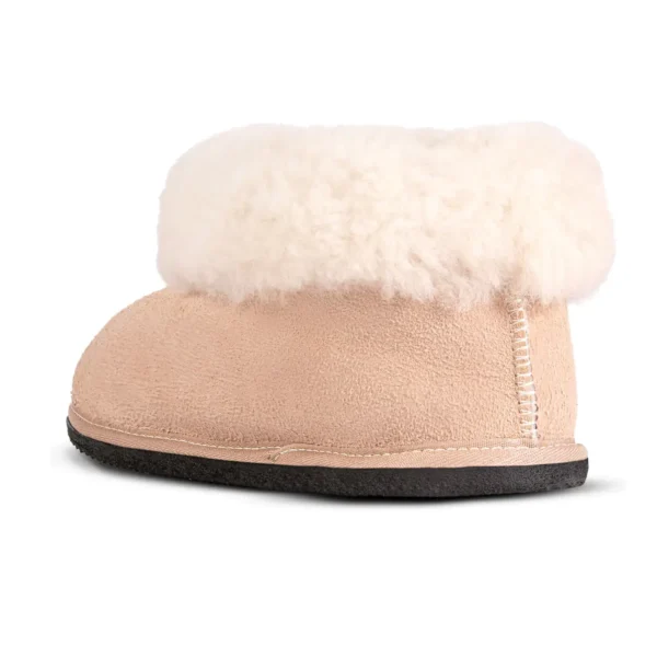 Karoo Classic sheepskin slipper shown from the side, featuring a warm fleece cuff and durable black sole.