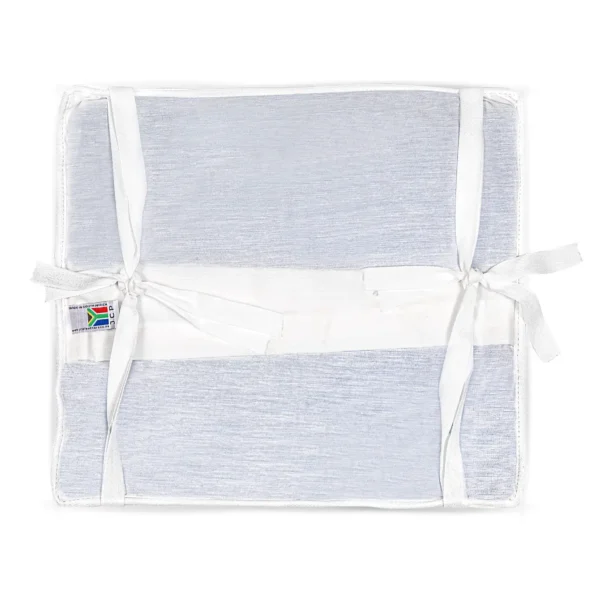Back view of sheepskin wheelchair cushion with securing straps.