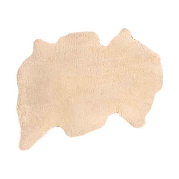 Top view of a soft, natural sheepskin baby rug.